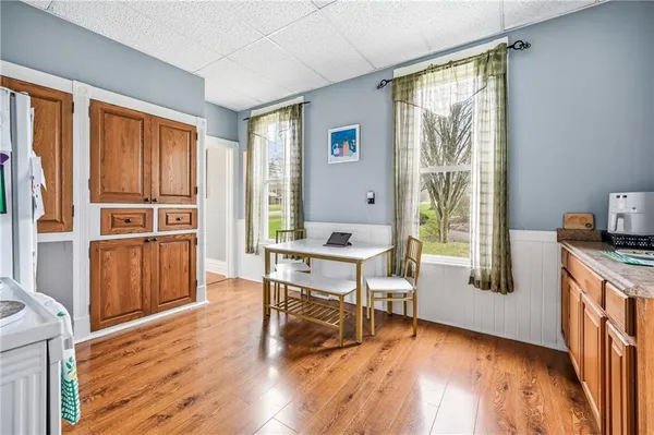 a workspace with furniture window and wooden floor