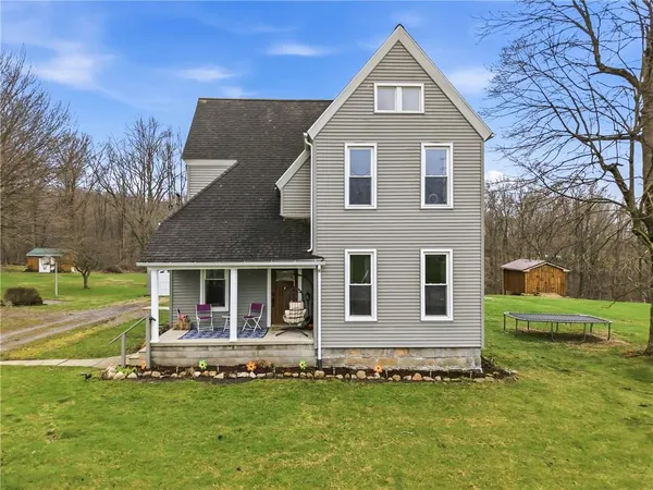 a front view of a house with a yard