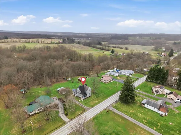 a view of a lake with a floor to ceiling window