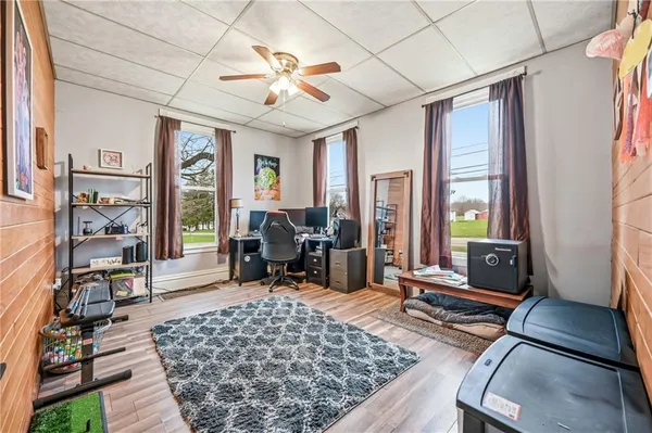 a living room with furniture rug and window