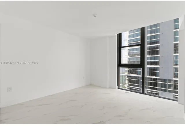 a view of empty room with windows