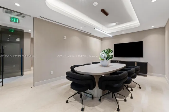 a spacious bedroom with two beds and a large window