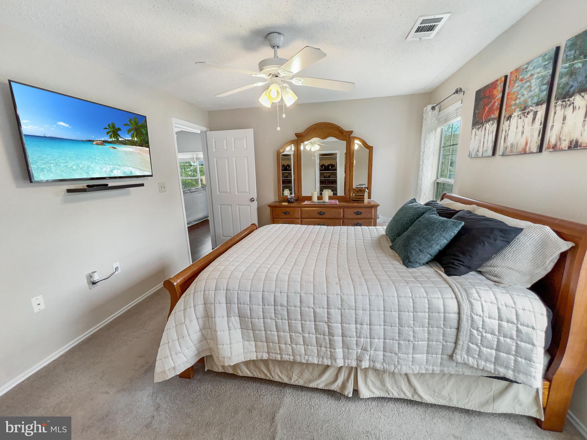 20985 Timber Ridge Terrace, Unit 302 Ashburn, VA 20147 - Photo 18 of 23 Ceiling fan and floods of natural light!