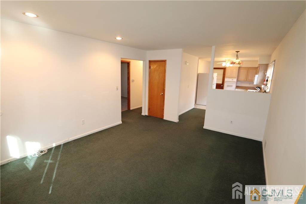 101 Stelton Road Piscataway, NJ 08854 - Photo 9 of 16 a view of an empty room with wooden floor