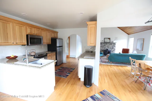 a kitchen with sink and refrigerator