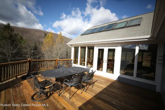 a view of a patio with wooden floor