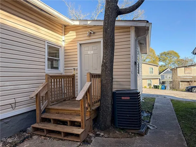 a view of a two chairs in the balcony