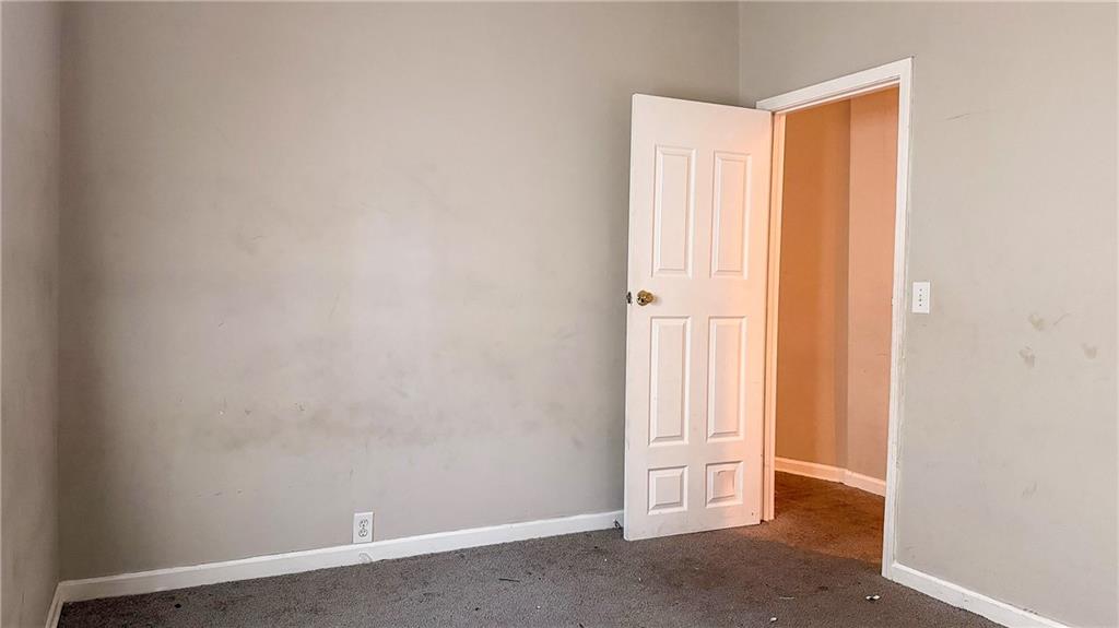 1188 Sims Street Southwest Atlanta, GA 30310 - Photo 13 of 17 an empty room with windows