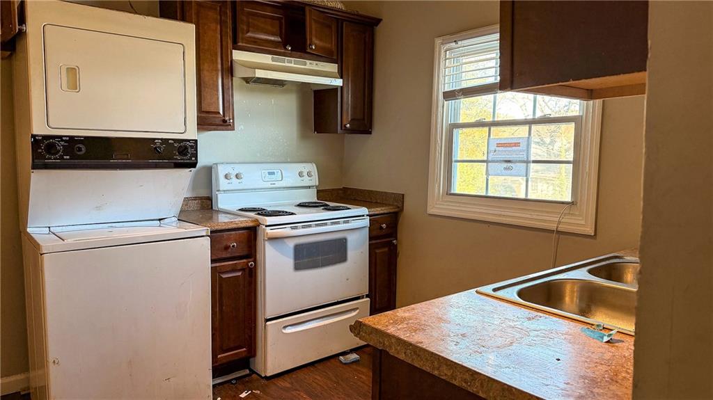1188 Sims Street Southwest Atlanta, GA 30310 - Photo 6 of 17 a kitchen that has a sink and a stove