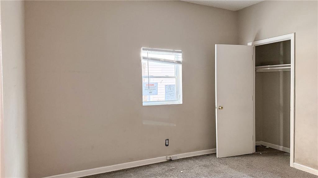 1188 Sims Street Southwest Atlanta, GA 30310 - Photo 9 of 17 a view of an empty room with closet area