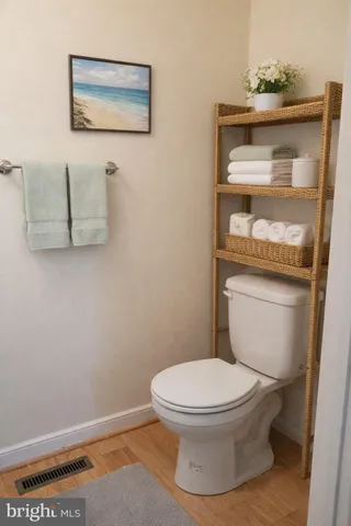 a view of entryway with a window and wooden floor