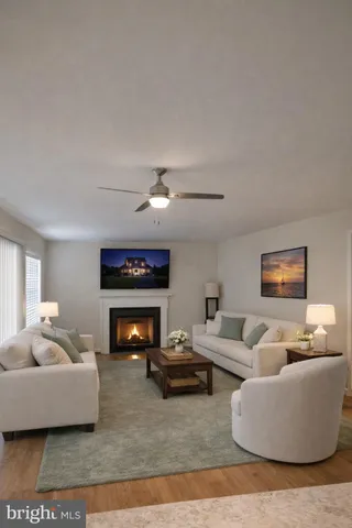 a kitchen with stainless steel appliances kitchen island granite countertop a table chairs sink and cabinets