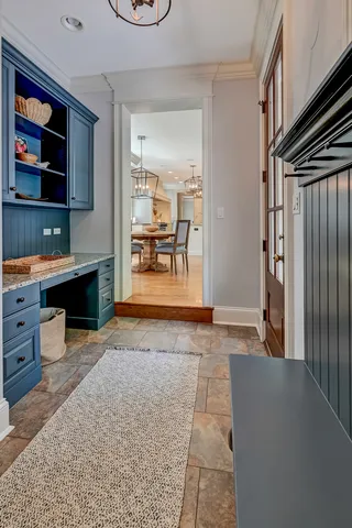 a kitchen with granite countertop a stove and a wooden floor