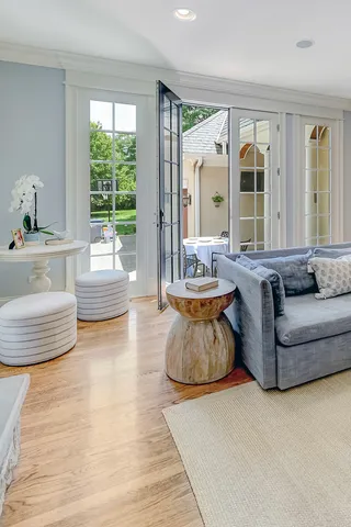 a front view of a house with outdoor seating