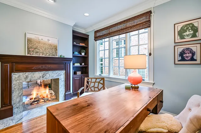 a view of a livingroom with furniture and a window