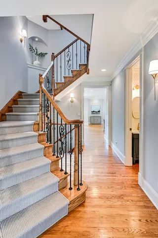 a bedroom with a bed and a fireplace