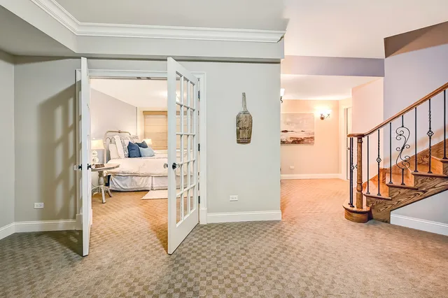 a dining room with furniture a kitchen view and a fireplace