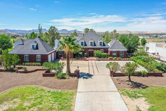an aerial view of a house with a garden and plants