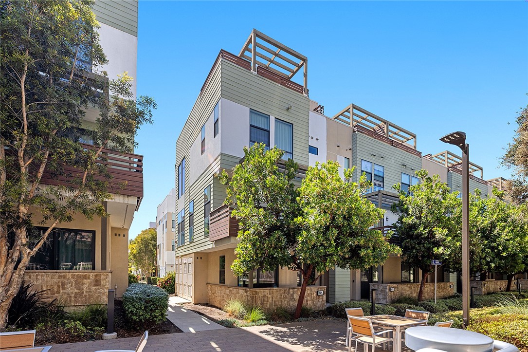 a front view of a building with trees