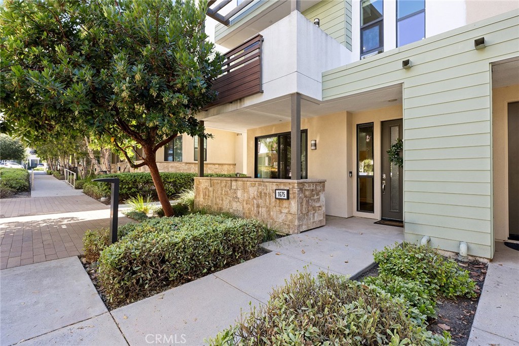1675 Grand View Costa Mesa, CA 92627 - Photo 3 of 35 a front view of a house with a yard