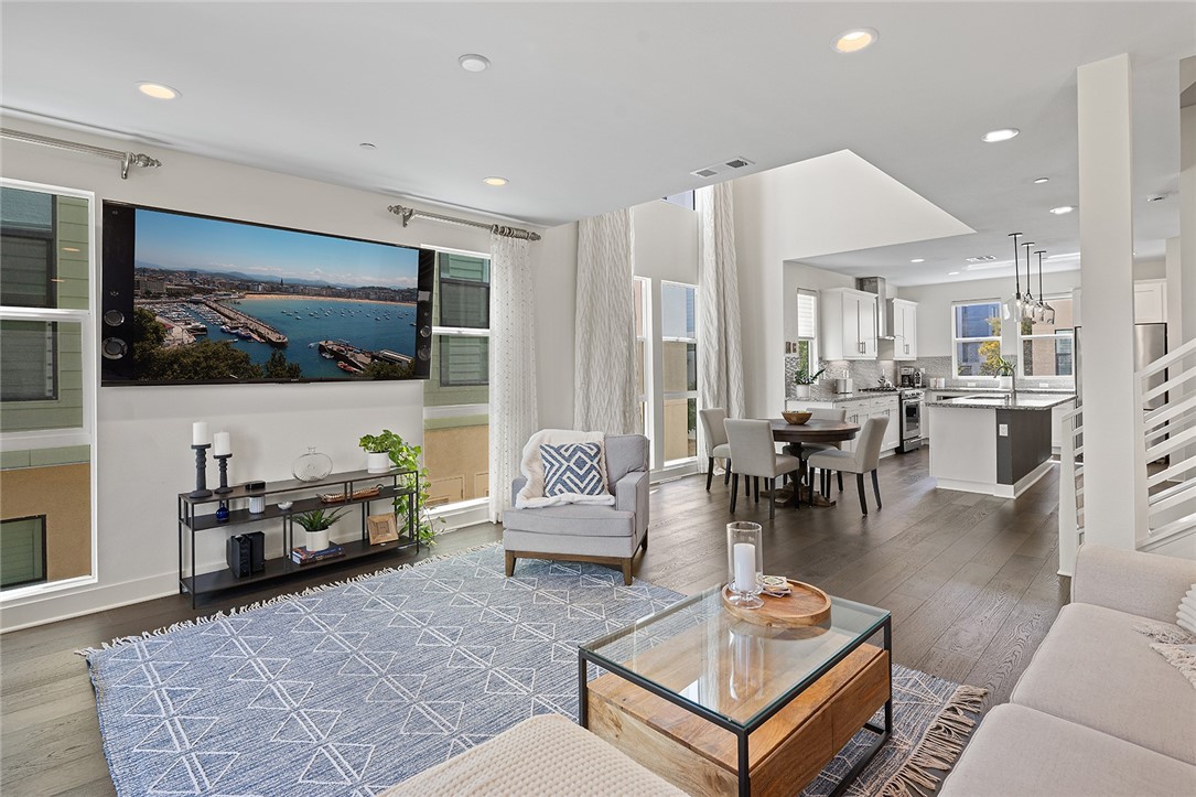1675 Grand View Costa Mesa, CA 92627 - Photo 5 of 35 a living room with furniture and a flat screen tv
