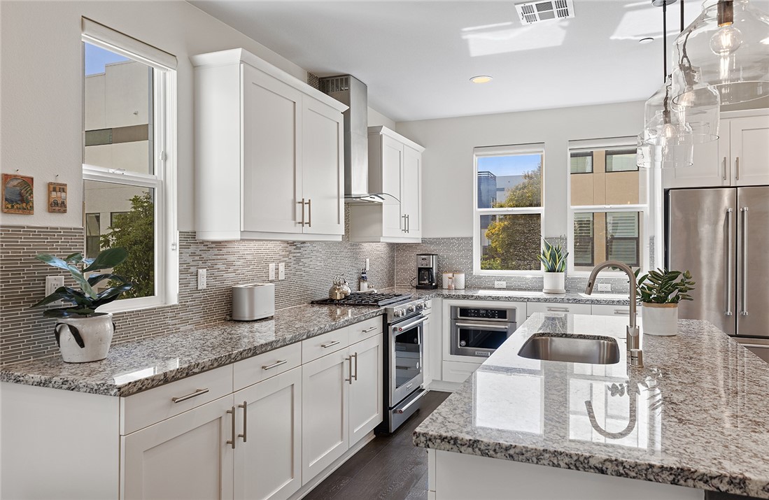 1675 Grand View Costa Mesa, CA 92627 - Photo 7 of 35 a kitchen with sink and cabinets