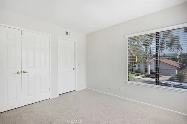 an empty room with sliding glass door