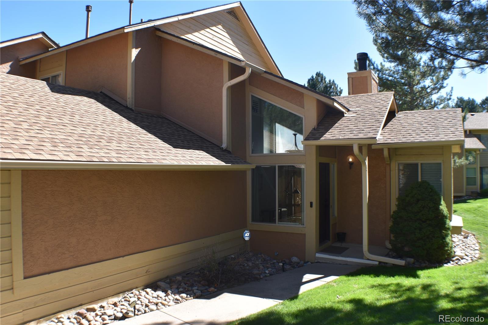 4075 Autumn Heights Drive, Unit F Colorado Springs, CO 80906 - Photo 1 of 44 a view of a house with a yard