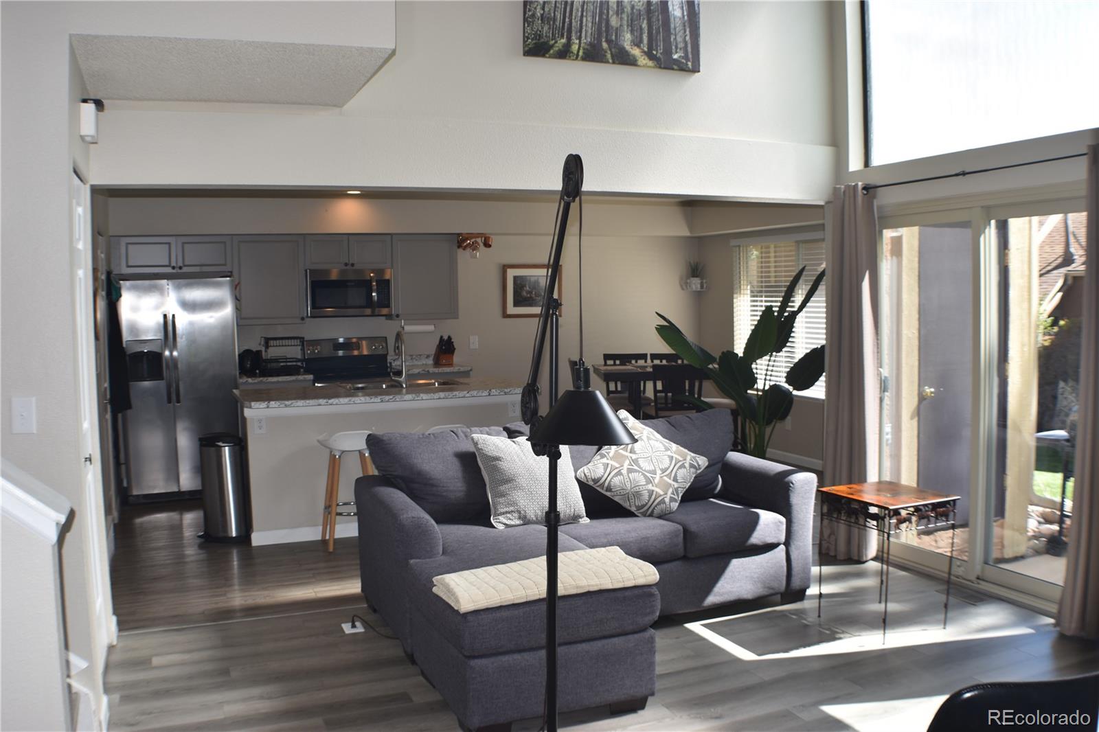 4075 Autumn Heights Drive, Unit F Colorado Springs, CO 80906 - Photo 15 of 44 a living room with furniture and a flat screen tv