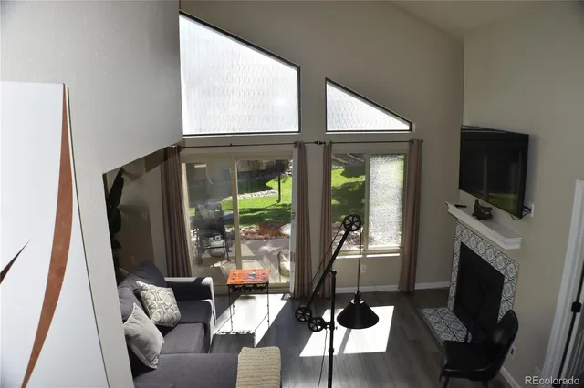 a living room with fireplace furniture and a flat screen tv