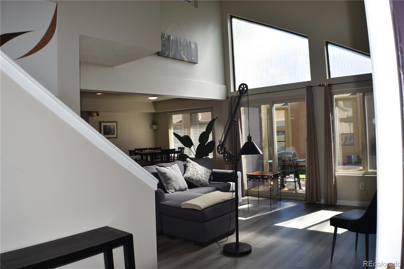 4075 Autumn Heights Drive, Unit F Colorado Springs, CO 80906 - Photo 3 of 44 a living room with furniture and a large window