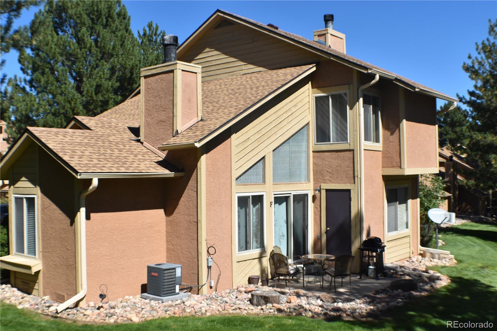 4075 Autumn Heights Drive, Unit F Colorado Springs, CO 80906 - Photo 36 of 44 a front view of a house with street