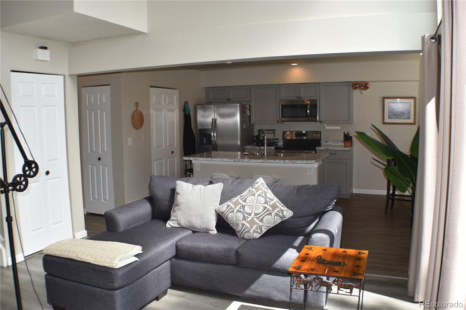 4075 Autumn Heights Drive, Unit F Colorado Springs, CO 80906 - Photo 5 of 44 a living room with furniture and wooden floor