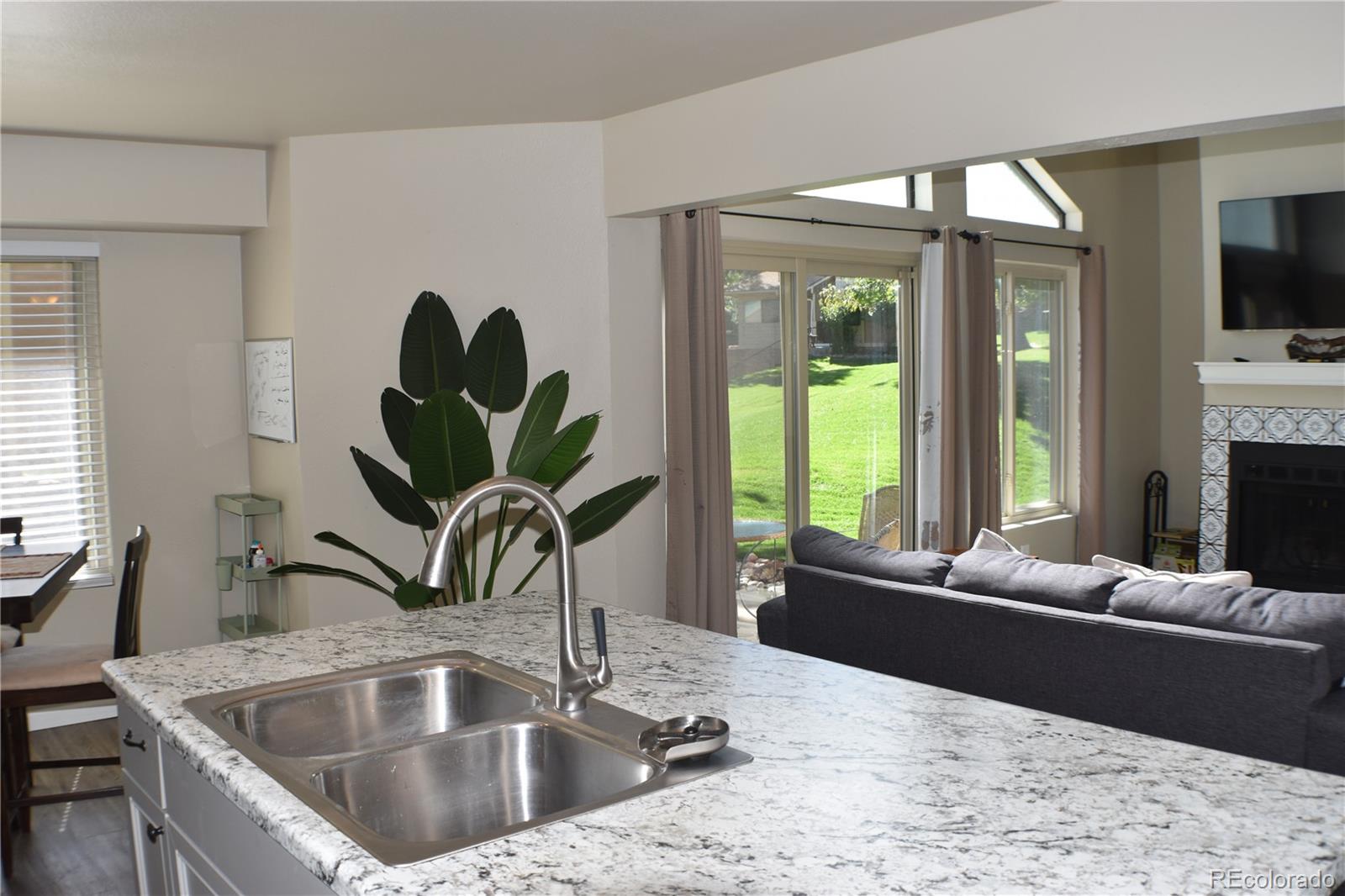 4075 Autumn Heights Drive, Unit F Colorado Springs, CO 80906 - Photo 10 of 44 a living room with furniture and a large window