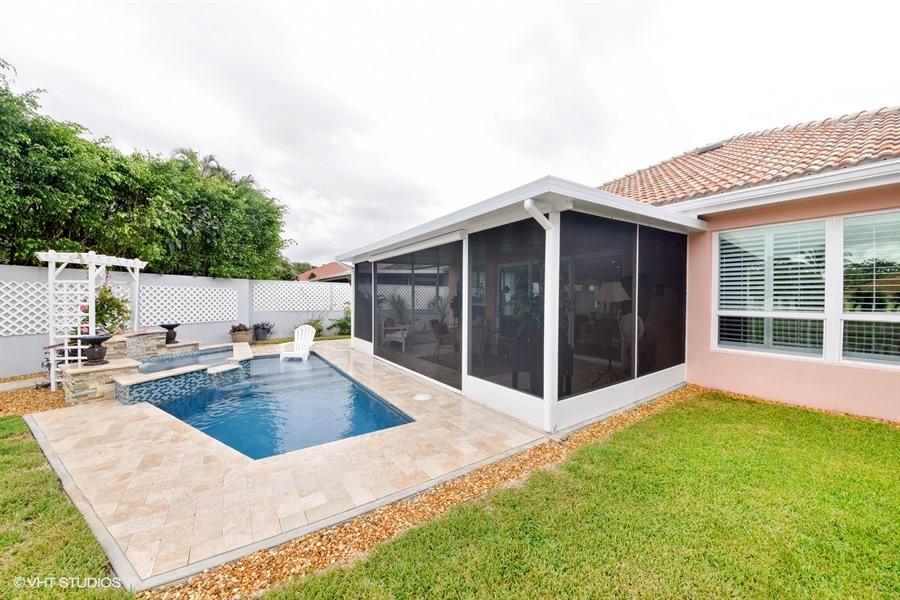 138 Hampton Circle Jupiter, FL 33458 - Photo 22 of 37 15_138HamptonCir_26_BackYard_LowRes