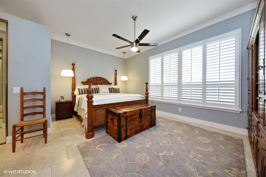 138 Hampton Circle Jupiter, FL 33458 - Photo 8 of 37 08_138HamptonCir_14_MasterBedroom_LowRes