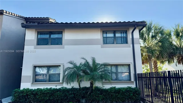 front view of a house with a small yard