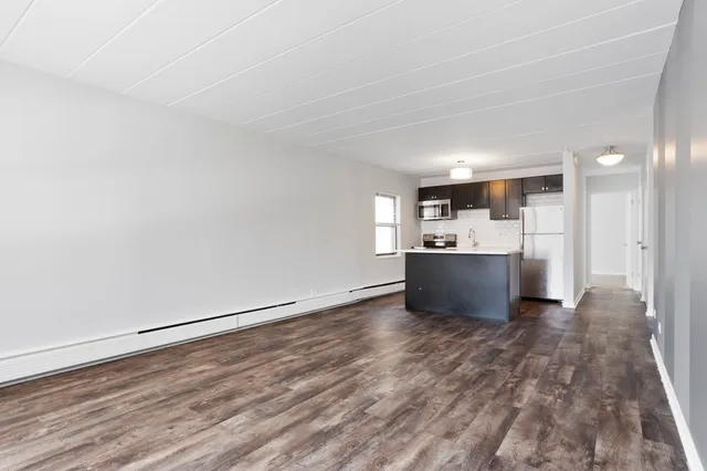 a view of kitchen with wooden floor