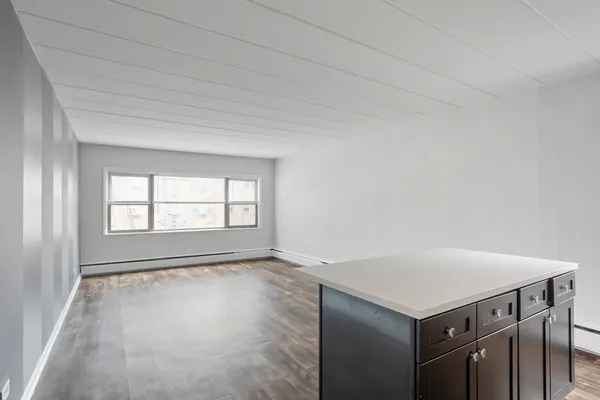 a view of an empty room with a window