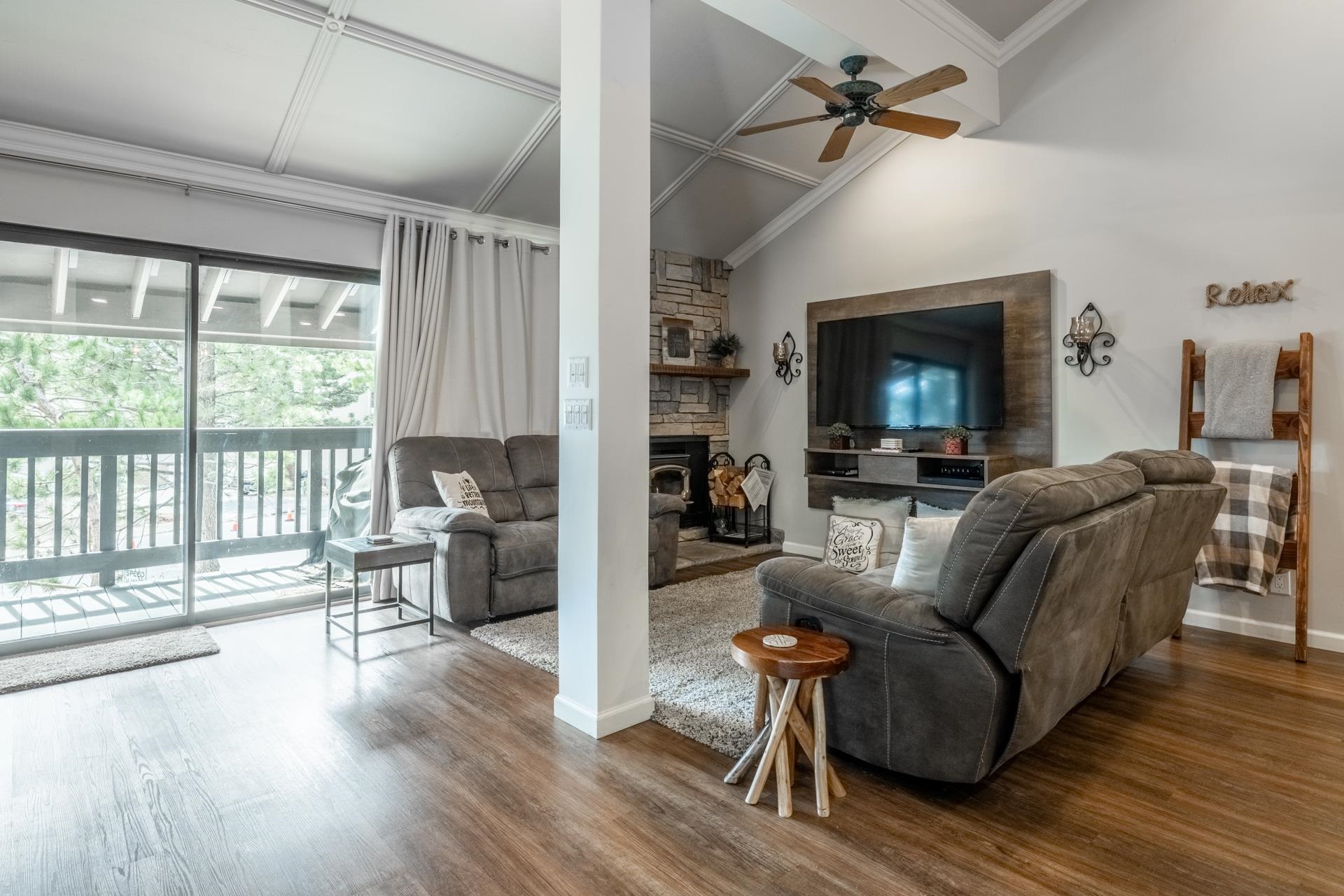 362 Old Mammoth Road, Unit 4 Mammoth Lakes, CA 93546 - Photo 2 of 50 Living area with wood finished floors, lofted ceiling, ceiling fan, a fireplace, and ornamental molding