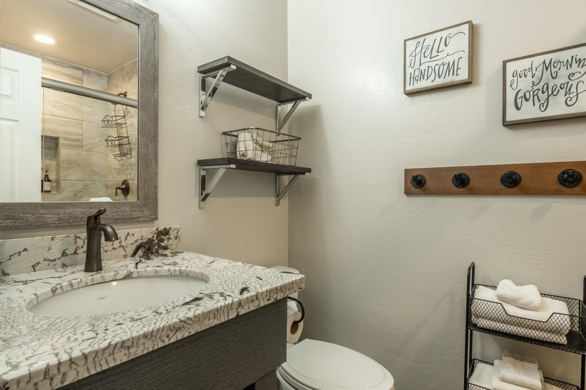 362 Old Mammoth Road, Unit 4 Mammoth Lakes, CA 93546 - Photo 21 of 50 Full bath featuring a textured wall, vanity, and a tile shower