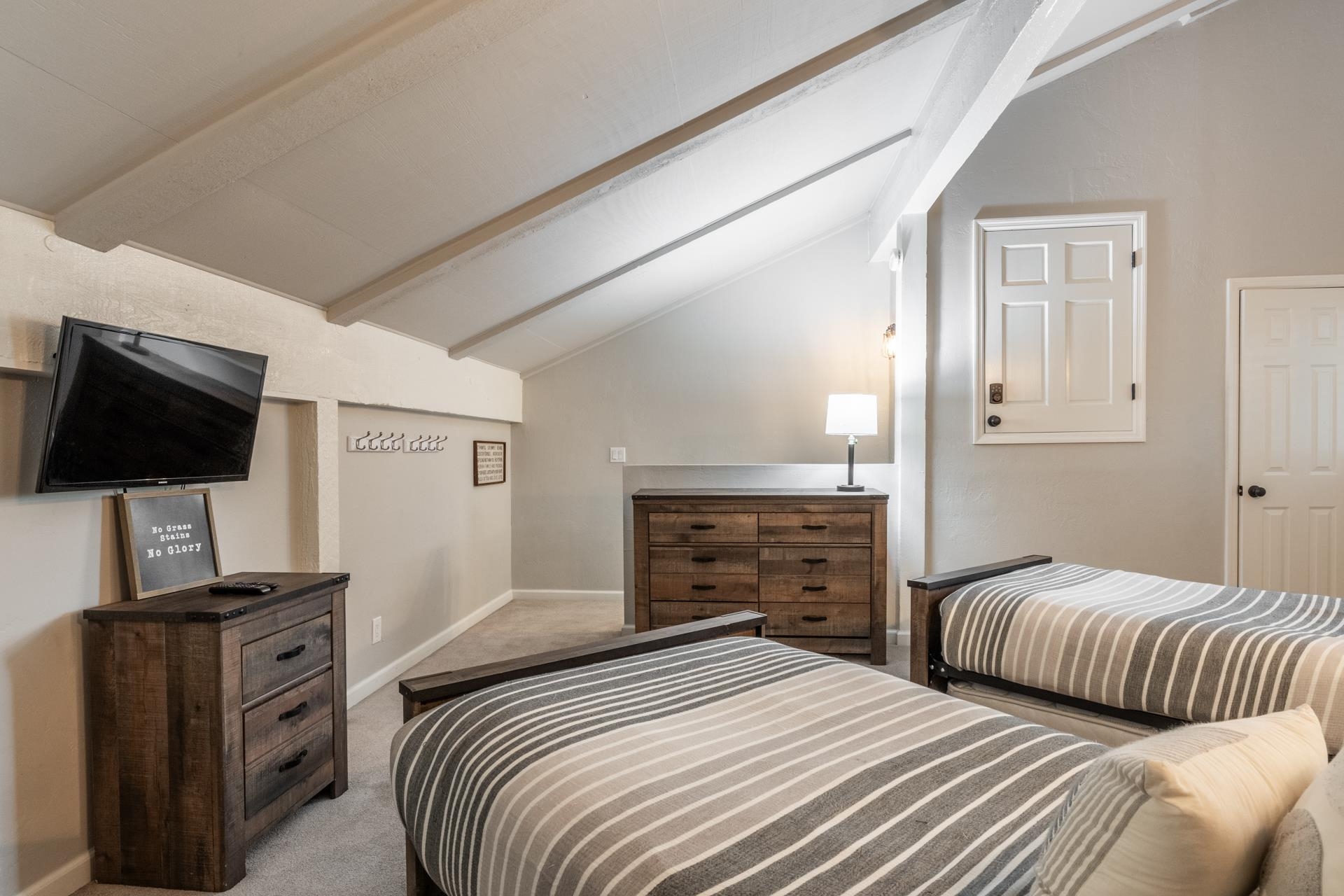 362 Old Mammoth Road, Unit 4 Mammoth Lakes, CA 93546 - Photo 33 of 50 Bedroom featuring light carpet and vaulted ceiling with beams