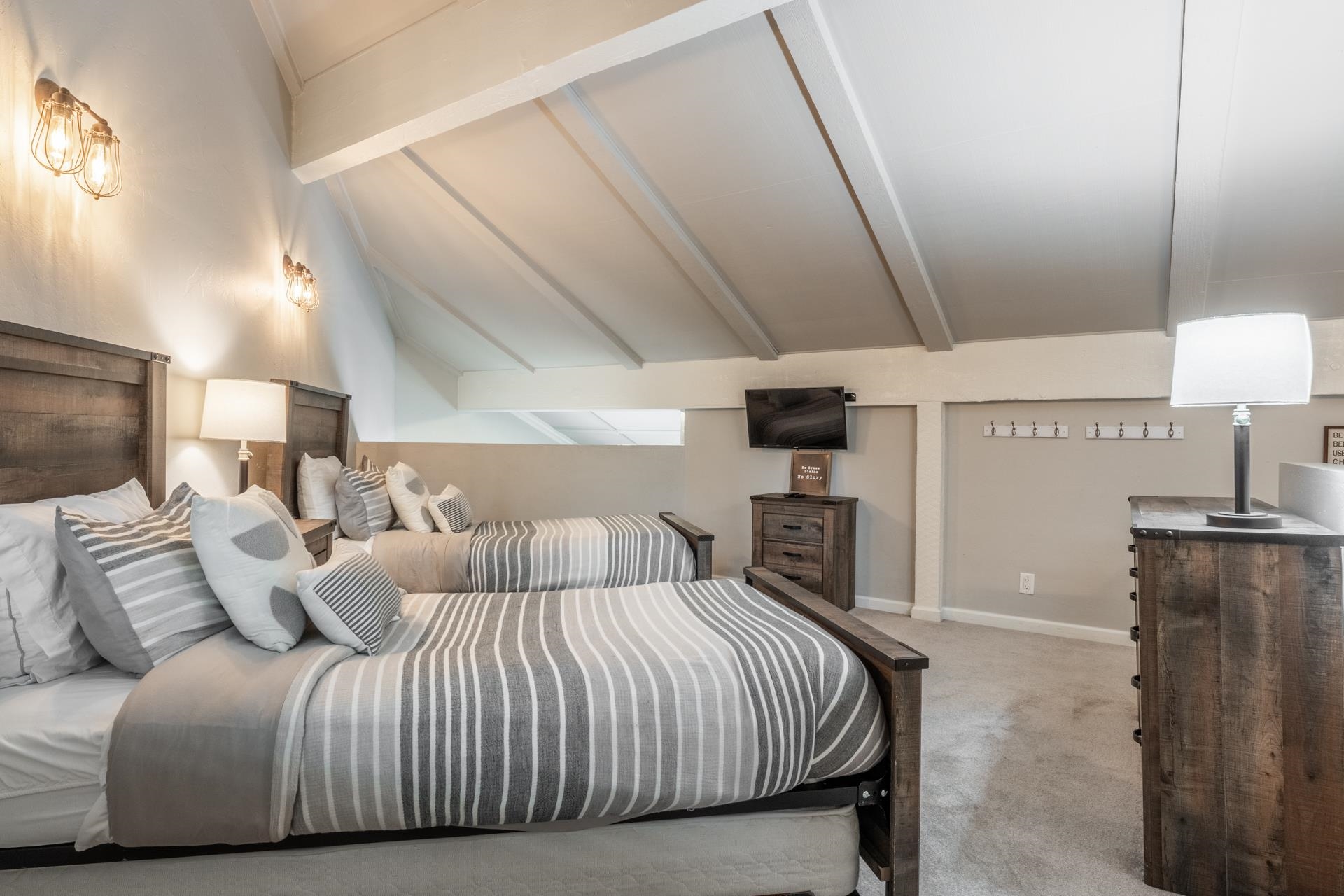 362 Old Mammoth Road, Unit 4 Mammoth Lakes, CA 93546 - Photo 35 of 50 Bedroom with light carpet and vaulted ceiling with beams