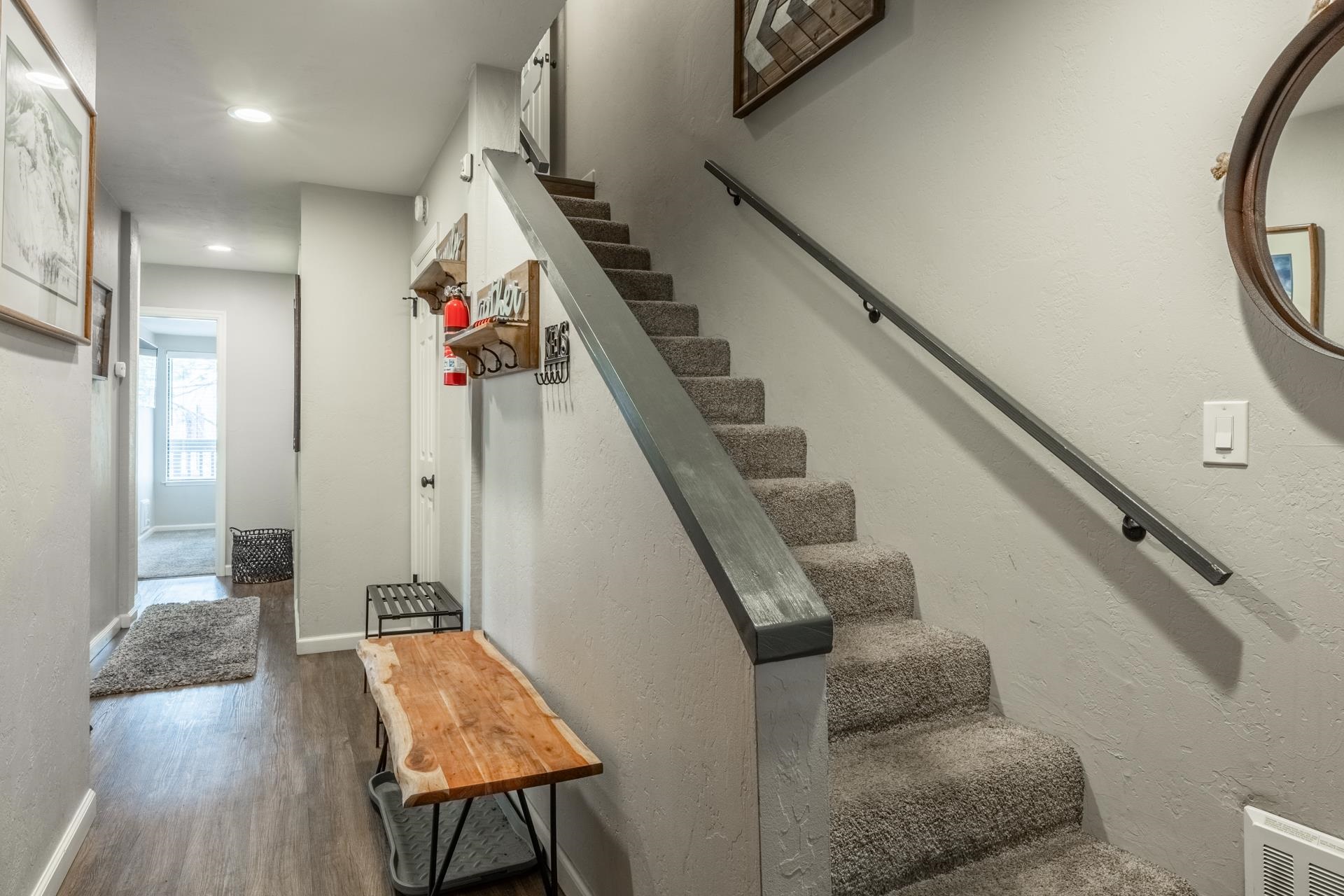 362 Old Mammoth Road, Unit 4 Mammoth Lakes, CA 93546 - Photo 36 of 50 Stairway with wood finished floors, a textured wall, and recessed lighting