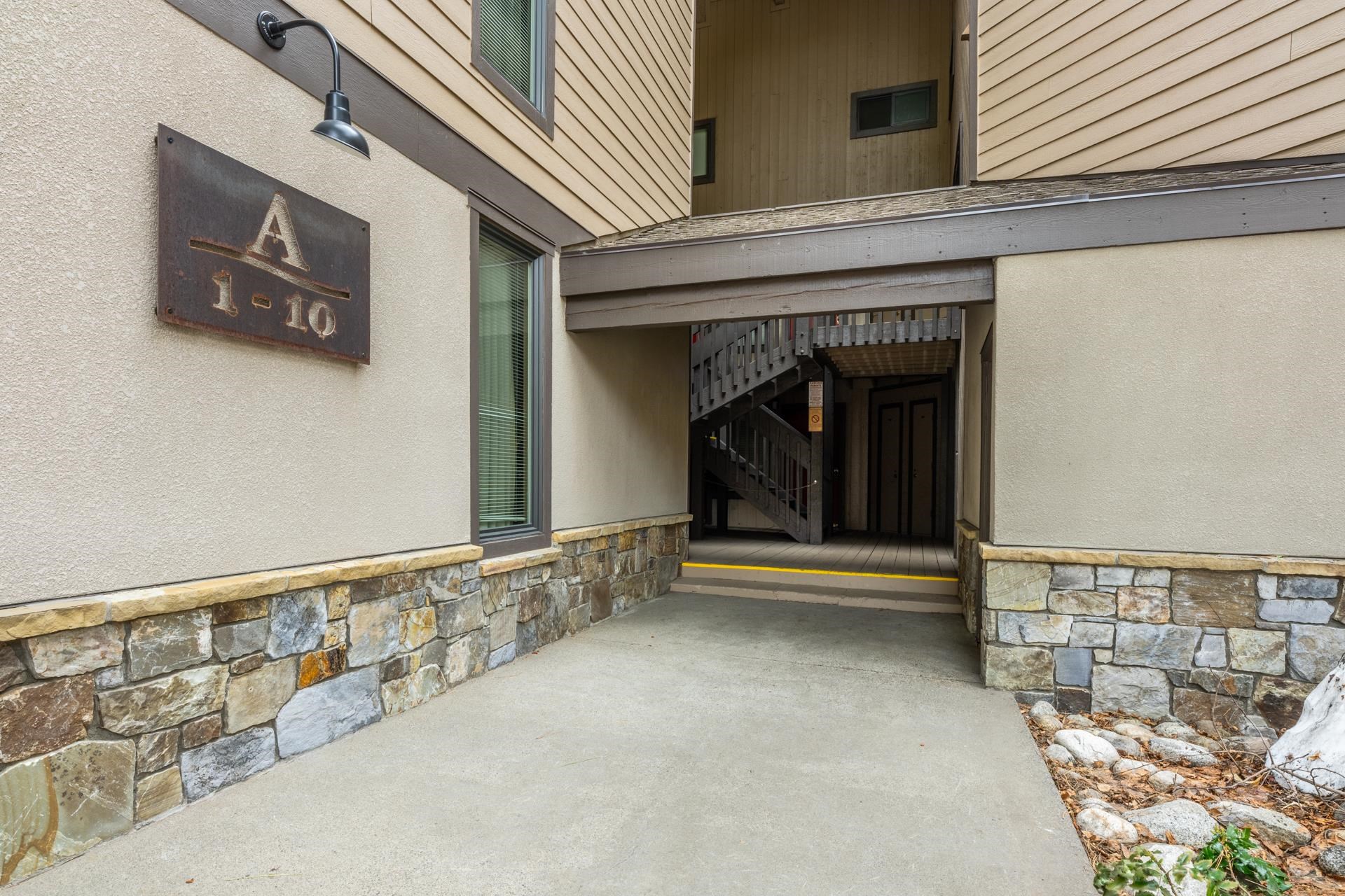 362 Old Mammoth Road, Unit 4 Mammoth Lakes, CA 93546 - Photo 38 of 50 Property entrance featuring stone siding, a patio, and stucco siding