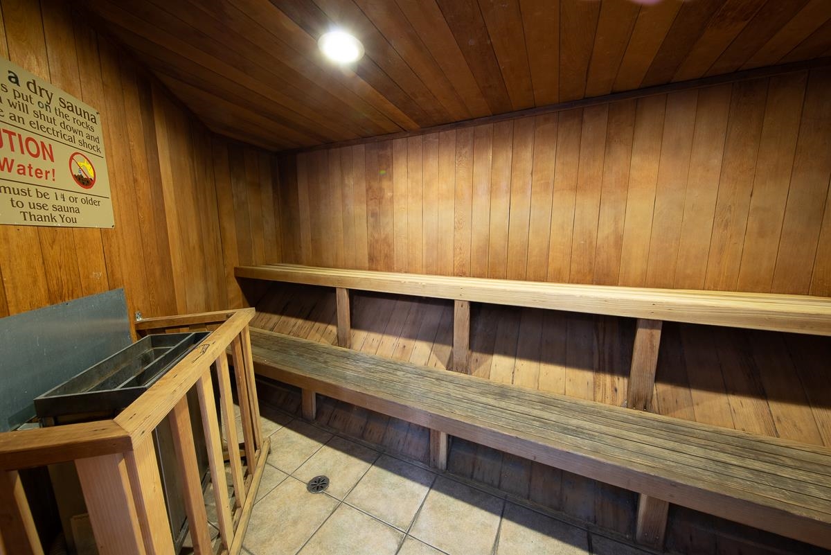 362 Old Mammoth Road, Unit 4 Mammoth Lakes, CA 93546 - Photo 46 of 50 Relaxing sauna with tile patterned floors, wooden walls, and wood ceiling