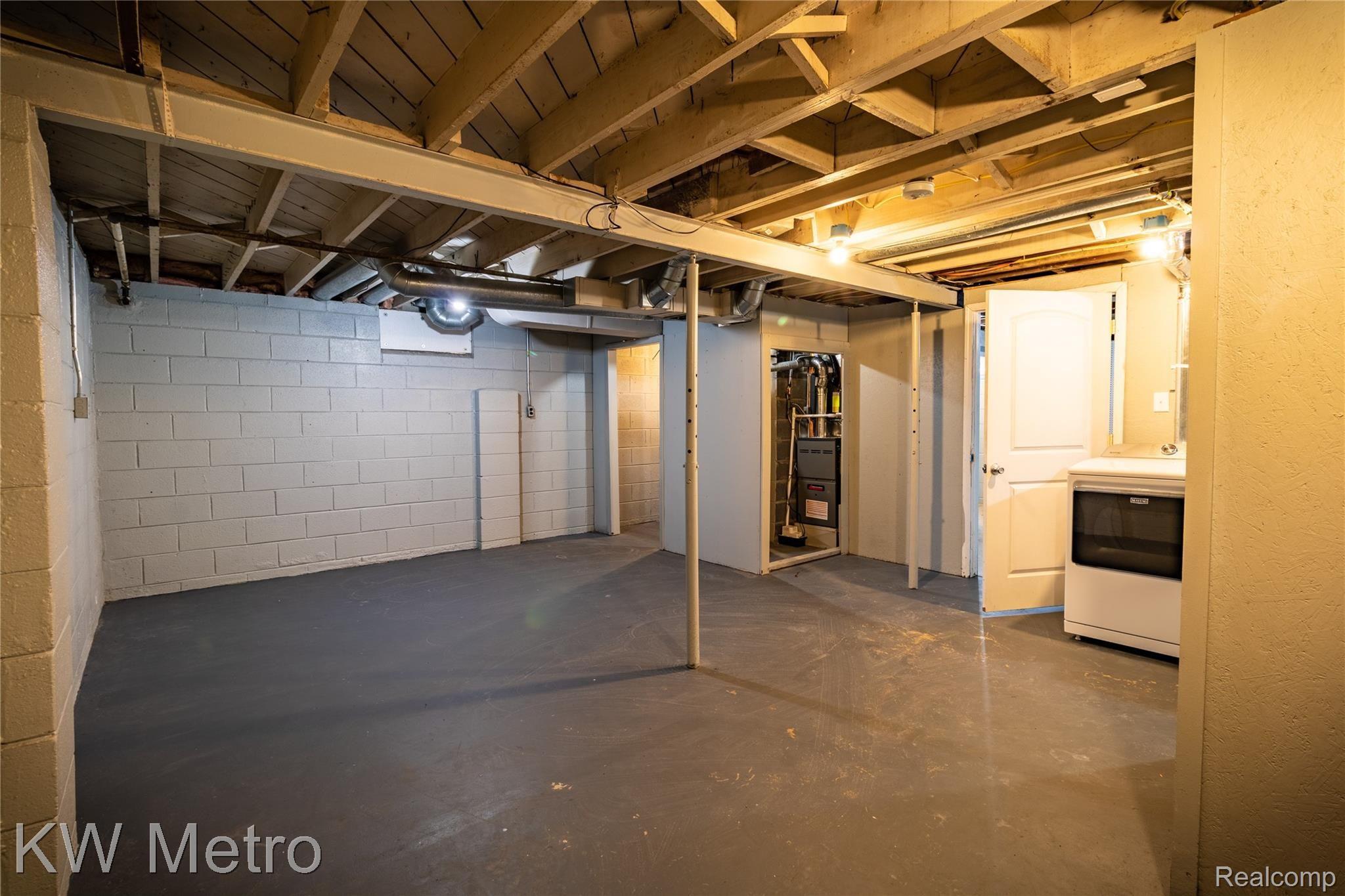 235 Eleanor Road Highland, MI 48356 - Photo 25 of 28 Another View of Basement w/New Furnace (2021)