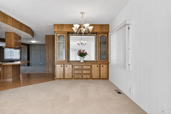 a kitchen with stainless steel appliances granite countertop a stove and a refrigerator