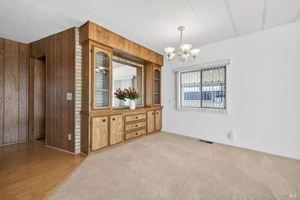 a kitchen with stainless steel appliances kitchen island granite countertop a refrigerator and a stove