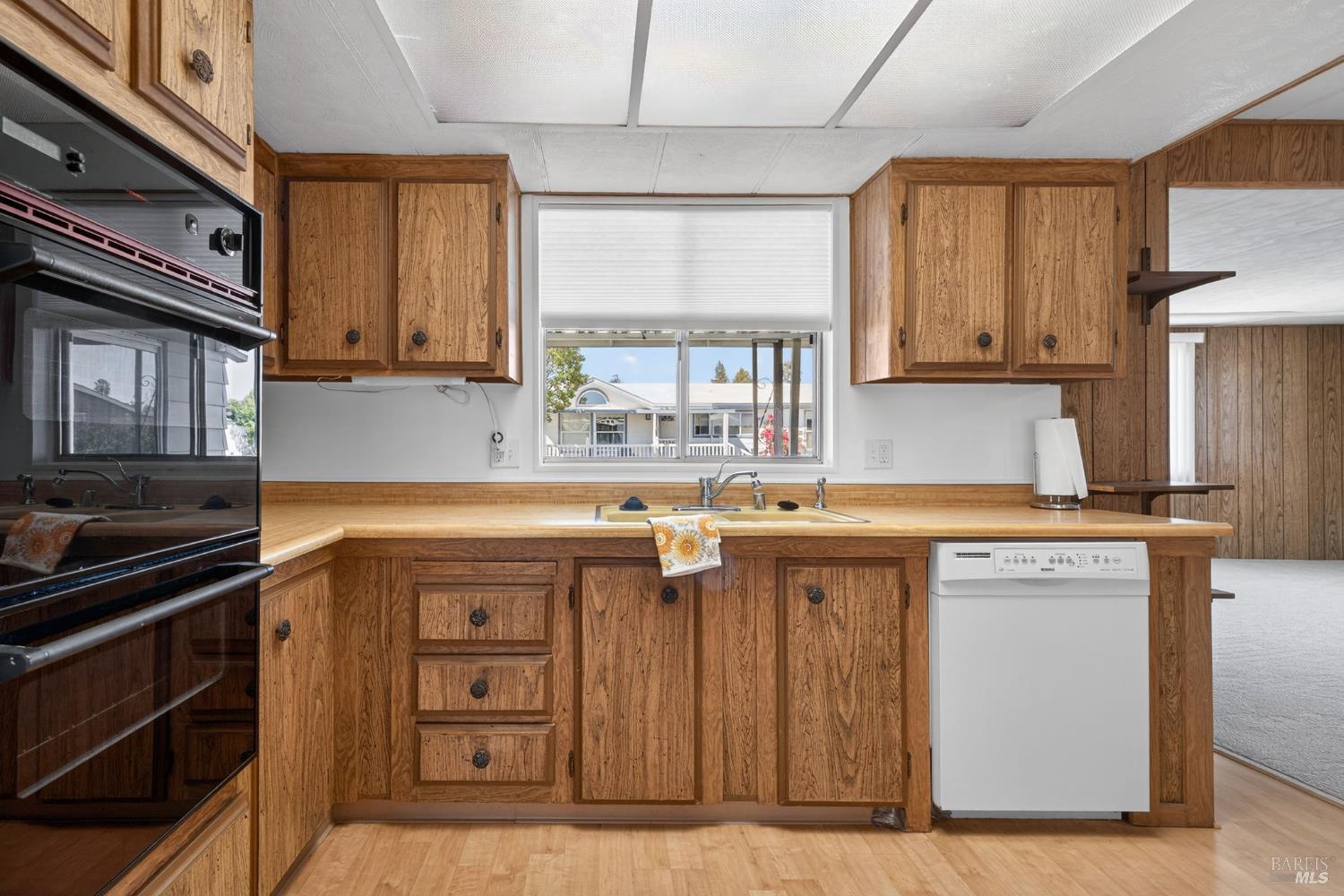 92 Anacapa Drive Santa Rosa, CA 95403 - Photo 18 of 46 a kitchen with stainless steel appliances granite countertop a stove a sink and a microwave